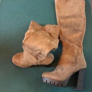 Tan size 7. Knee high womans boot heals.